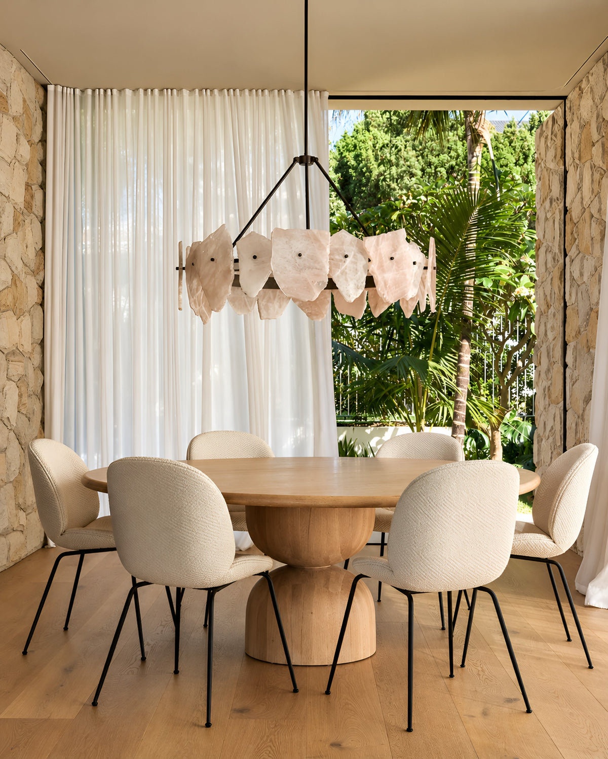 Hourglass dining table with upholstered dining chairs
