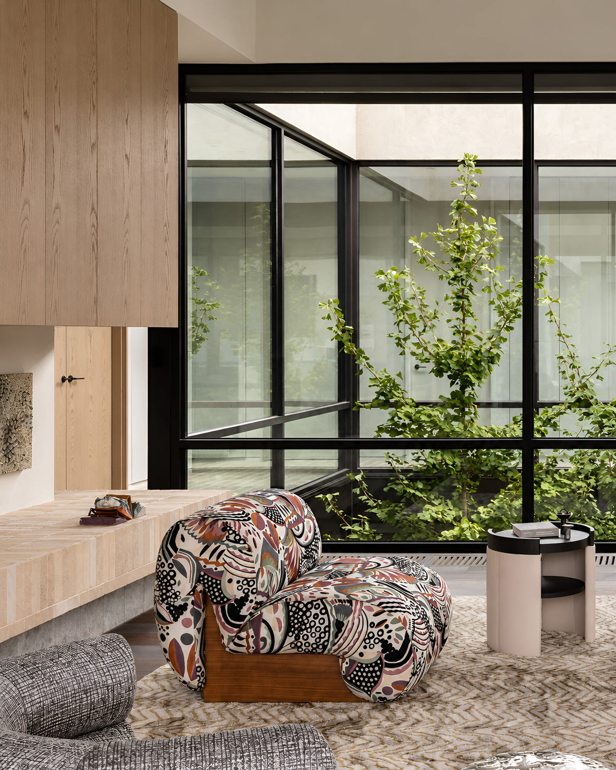 Boba chair in a patterned fabric with a timber base